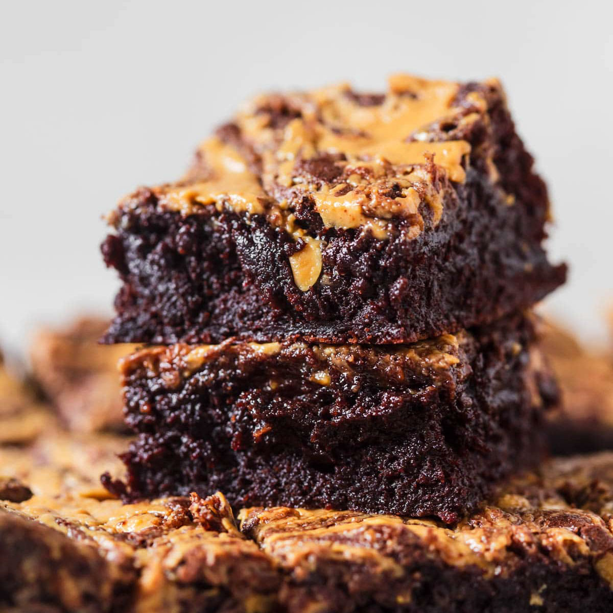 Peanut butter brownies in a stack.